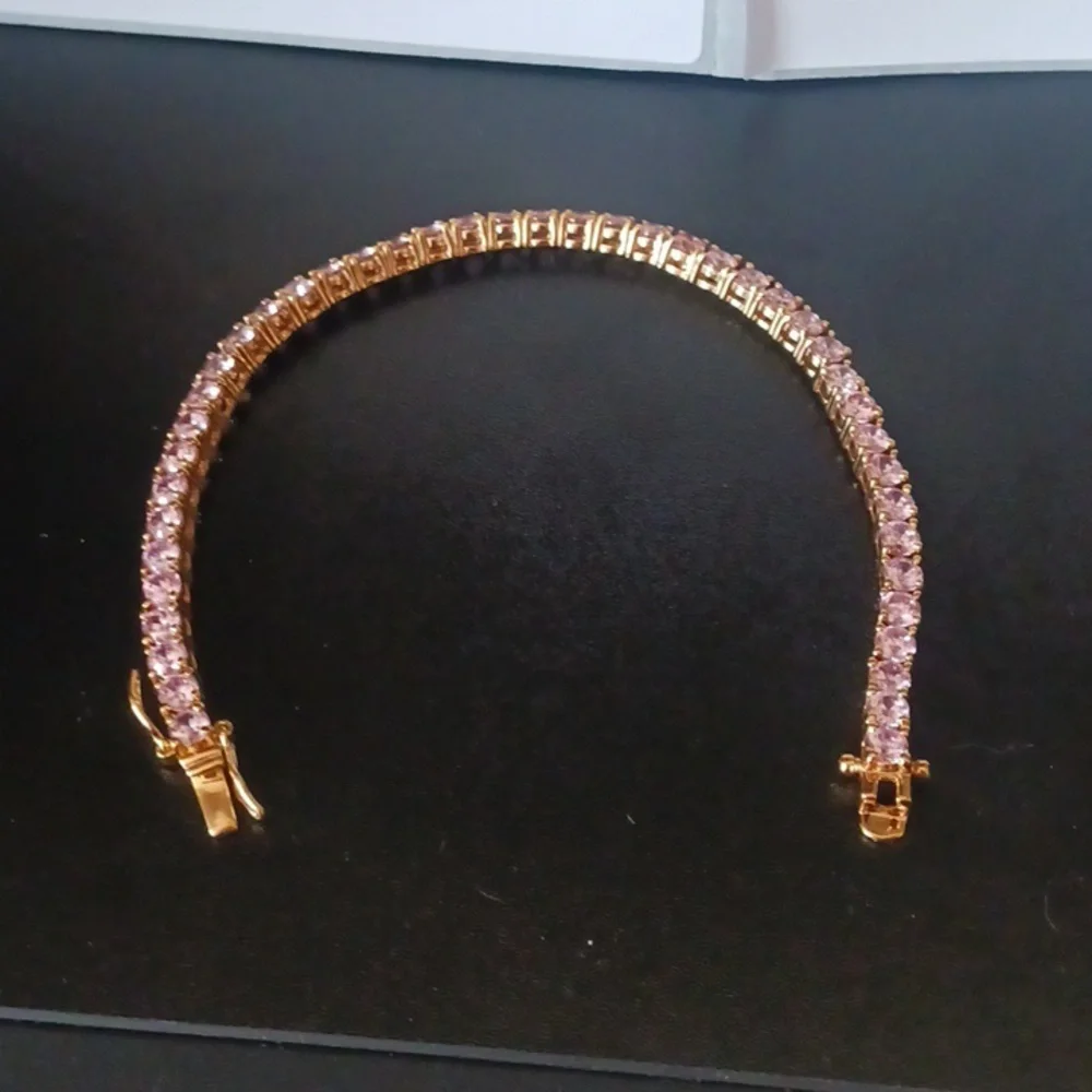 Elegant Gold Tone Bracelet with Pink Stones